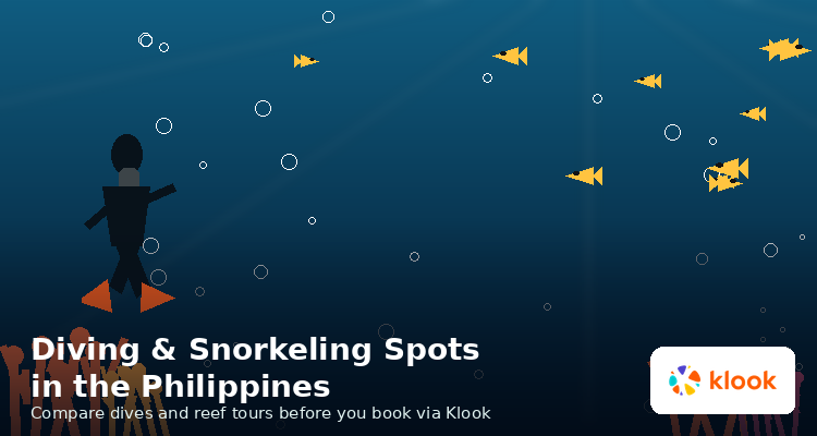 Scuba diver swimming over a coral reef with a school of fish, Philippines