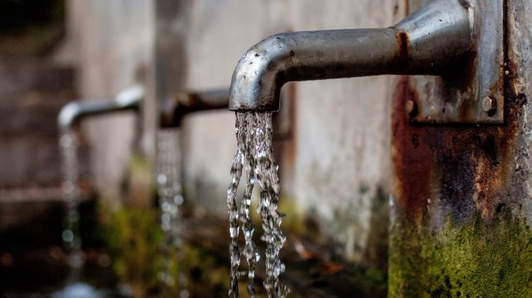 Water dripping from an outdoor faucet