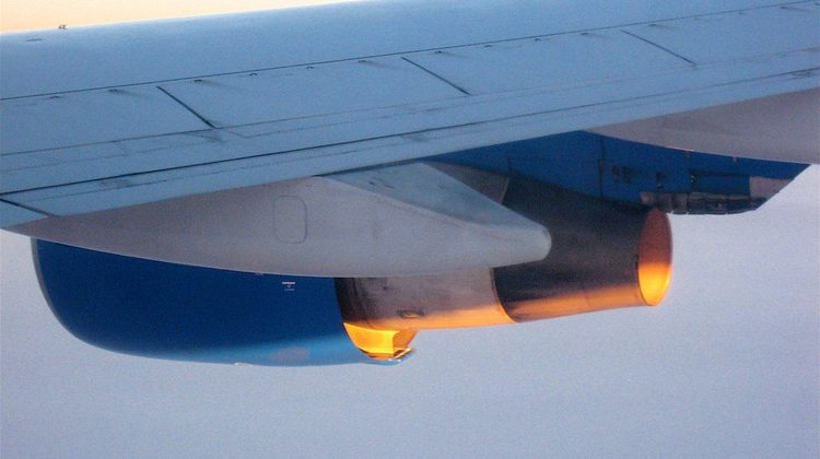 Airplane wing against the sky during flight